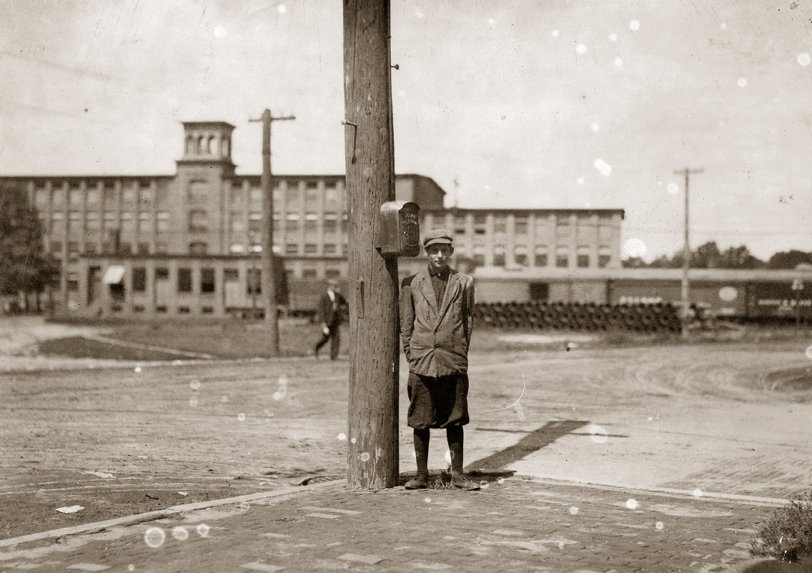 Stephen Warren, 284 Main St., Indian Orchard. Has doffed all summer in Indian Orchard Mfg. Co. Quit a few days ago but expects to get another job soon. Says he will not go to school. Location: Indian Orchard, Massachusetts. September 1911. Photo by Lewis Wickes Hine. In a textile mill, the doffer removes the bobbins from a carding machine once they are full, having been wound with wool yarn or cotton thread.  View full size.