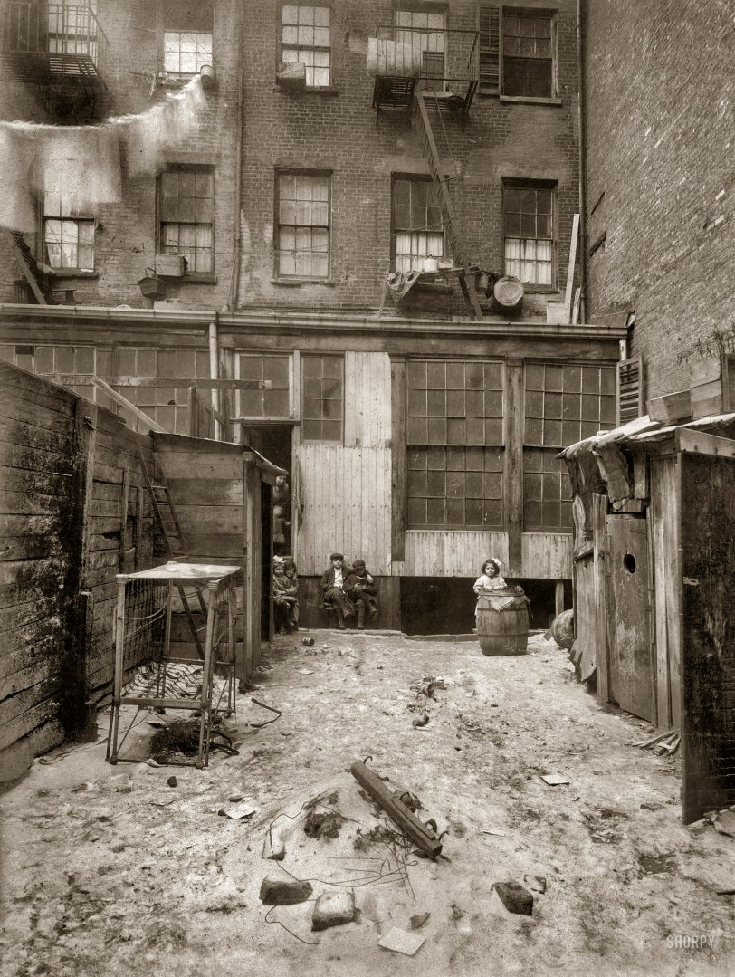 February 1912. "Rear view of tenement, 134½ Thompson Street, New York City. Makers of artificial flowers live and work here." Photograph and caption by Lewis Wickes Hine. View full size.