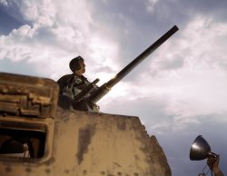 Tank commander, Fort Knox. June 1942. View full size. 4x5 Kodachrome transparency by Alfred Palmer for the Office of War Information.
