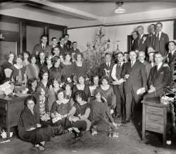 &nbsp; &nbsp; &nbsp; &nbsp; It's the Friday before Christmas, time for a hallowed holiday tradition here at Shorpy: The Office Xmas Party! Which has been going on for 99 years now. Will Clarence in Sales ever get up the nerve to ask out Hermione from Accounting? Is there gin in that oilcan? Ask the bear.
December 1925. "Washington, D.C. -- Western Electric Co. group." There are enough little dramas playing out here to keep the forensic partyologists busy until Groundhog Day. 8x10 inch glass negative, National Photo Company Collection. View full size.