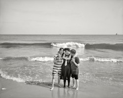 Coney Island, New York, circa 1905. "Two strings to her beaux." 8x10 inch dry plate glass negative, Detroit Publishing Company. View full size.