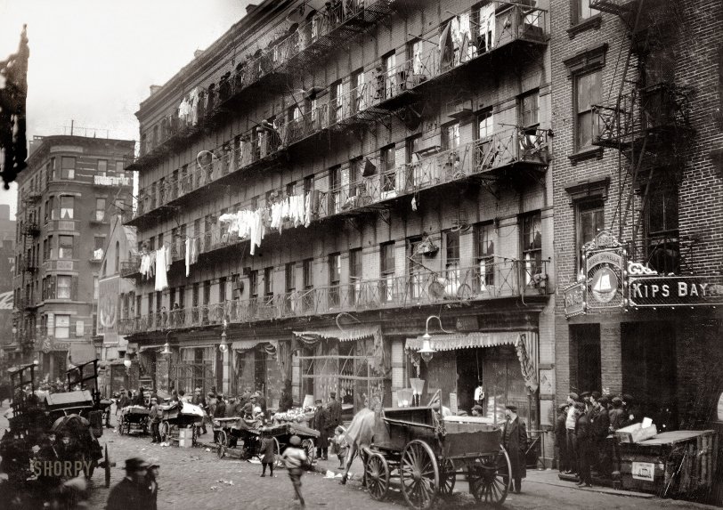 March 1912. "Row of tenements, 260 to 268 Elizabeth Street, New York, in which a great deal of finishing of clothes is carried on." 268 Elizabeth Street, in Little Italy, is now a "luxe sweater bar" called Sample; 258 (Kips Bay) is a handbag boutique called Token. Photo by Lewis Wickes Hine. View full size.