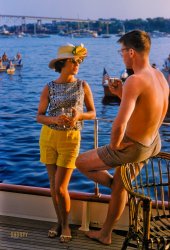 June 18, 1960. "Rowing, Harvard-Yale Regatta. Crew race at New London, Connecticut." Here we are back aboard the Versatile, quaffing cocktails on the Thames with Cabin Boy and the Catch of the Day. Can he reel this one in? 35mm Kodachrome by Toni Frissell. View full size.