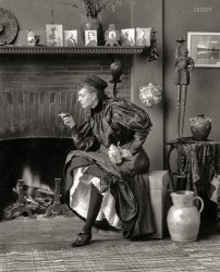 &nbsp; &nbsp; &nbsp; &nbsp; Frances Benjamin Johnston (1864-1952), best known on these pages as a prolific chronicler of Southern architecture, was also something of a feminist firebrand in her younger years. The photographer is seen here at age 32 in a triple-threat sendup of the 1890s "New Woman" -- smoking, drinking, showing some leg.
Self-Portrait as "New Woman," 1896. "Frances Benjamin Johnston, seated in front of fireplace, facing left, holding cigarette in one hand and beer stein in the other, in her Washington, D.C., studio." Gelatin silver print. View full size.