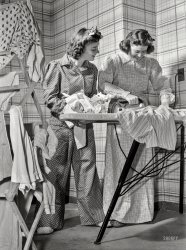 October 1942. "Health measures for low home temperatures. Down goes the thermometer and out come flannel nightclothes, almost like the kind Grandpa used to wear, as government workers in Washington, D.C., dress for the 65-degree maximum temperature recommended by the fuel oil limitation order." Photo by Albert Freeman for the Office of War Information. View full size.