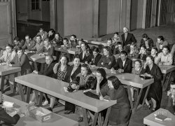 February 1942. Woodville, Calif. "FSA farm workers' community. First aid class." Today's lesson: finger splints! Photo by Russell Lee for the Farm Security Administration. View full size.