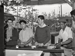 March 1942. El Centro, California. "Boys at carnival attraction. Imperial County Fair." Medium format acetate negative by Russell Lee for the Office of War Information. View full size.