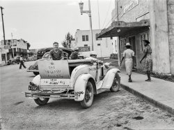 June 1940. "Some of the younger Osceola migratory camp members who have come to the post office in Belle Glade, Florida, for their mail." Medium format negative by Marion Post Wolcott for the Farm Security Administration. View full size.