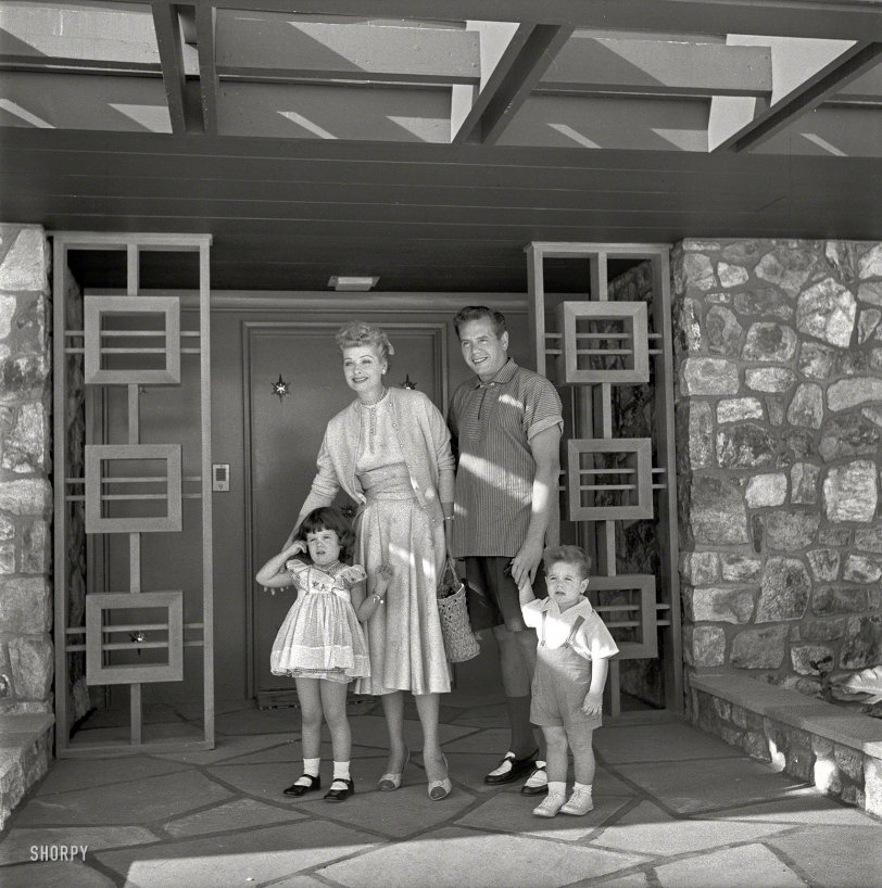 1954. "Actress Lucille Ball and husband Desi Arnaz with children Desi Jr. and Lucie in front of their Palm Springs home." Photo by Maurice Terrell for the Look magazine assignment "Lucy Goes Shopping." View full size.