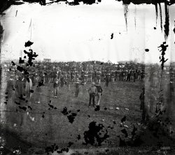 &nbsp; &nbsp; &nbsp; &nbsp; "President Abraham Lincoln delivered his Gettysburg Address at the dedication. Examination of the image in 2007 by members of the Center for Civil War Photography indicates that Lincoln may be visible in the crowd when viewed through magnification."
-- Library of Congress Prints & Photographs Division
November 19, 1863. "Dedication of Monument at Gettysburg, Pennsylvania." Wet plate glass negative by Alexander Gardner. View full size.