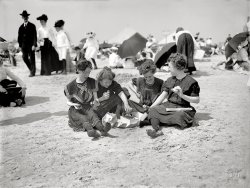 Coney Island, New York, circa 1905. "Picnicing on the beach -- a hasty lunch." 8½ x 6½ inch dry plate glass negative, Detroit Publishing Company. View full size.